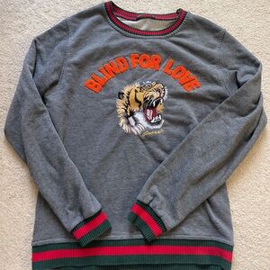 Gray Sweatshirt with Red and Green Accents